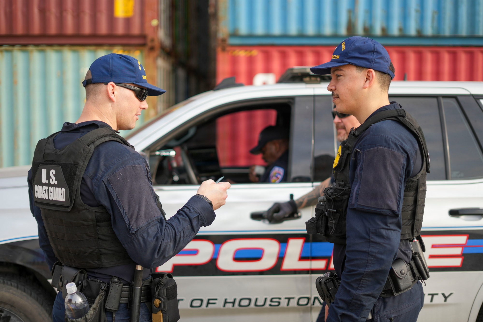 Freight operations team beside cargo containers
